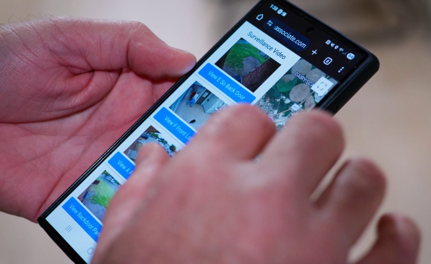 The responder's own phone — live camera feeds for the building